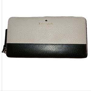 Kate Spade wallet EUC in perfect condition. 4"H x 7.5"W black and cream color.